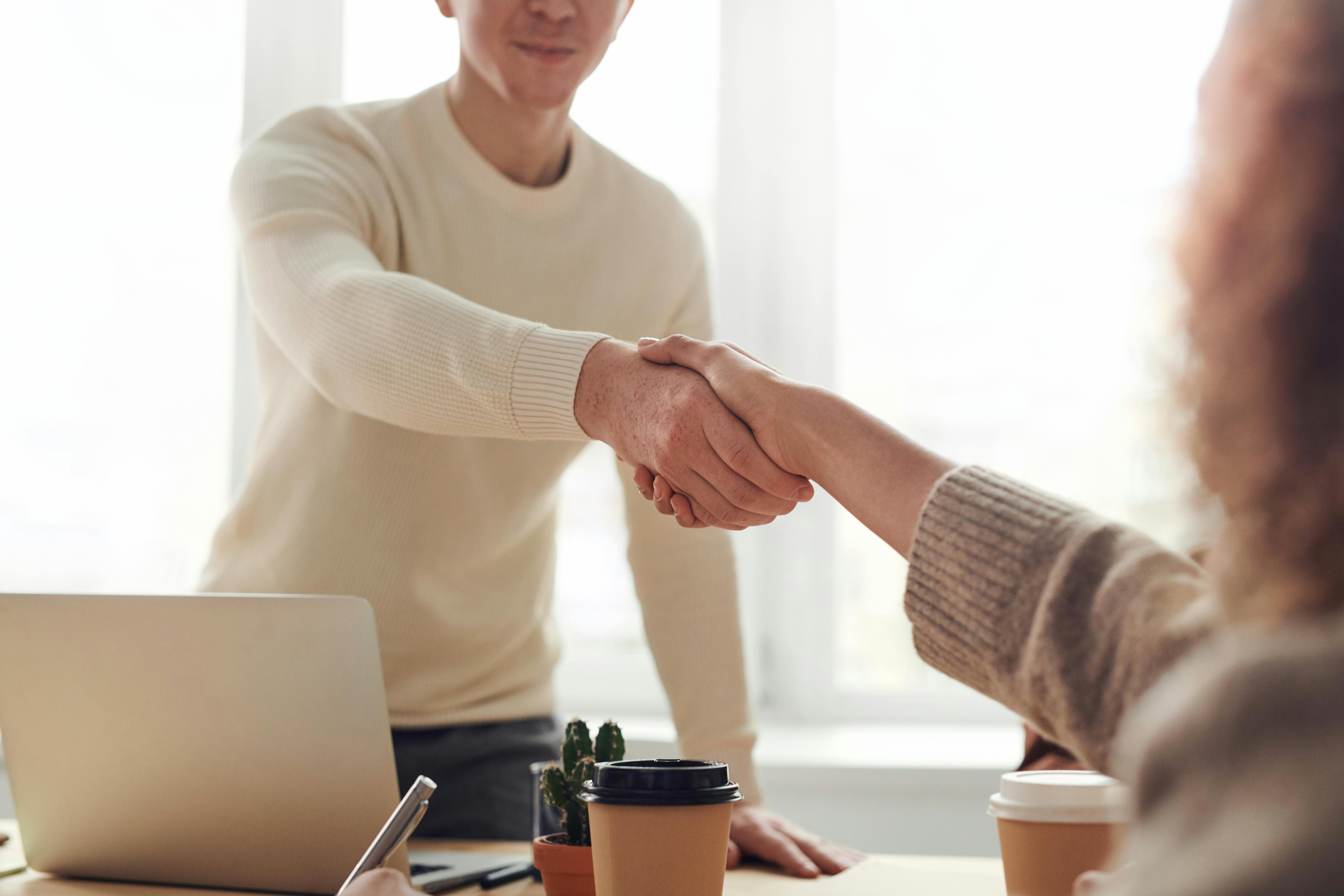 Business professionals in conversation with icheetz.life AI assistant helping navigate critical business discussions and negotiations
